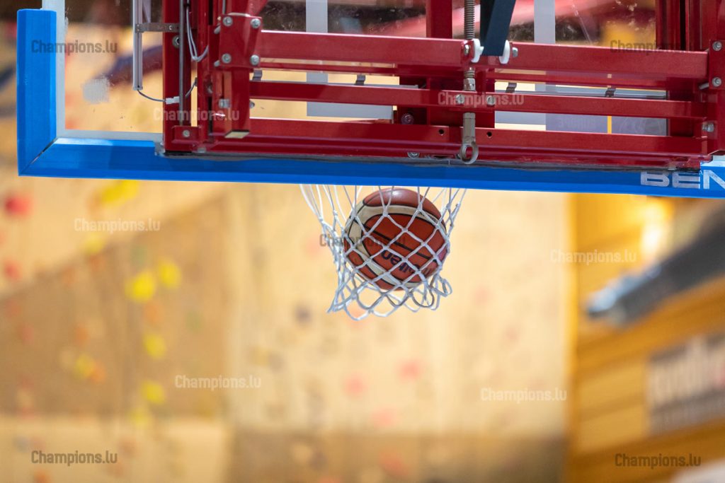 Basketball ball in hoop
